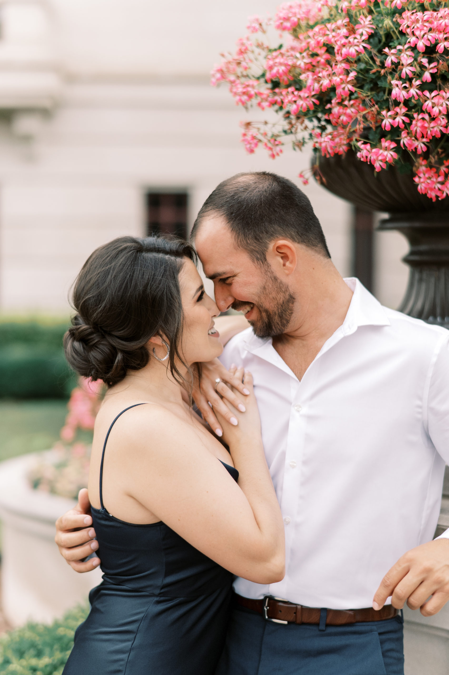 Engagement session in Carmel, Indiana. Noblesville wedding photographer. Palladium, performing arts center photoshoot. Sleek building in Indianapolis. Outfit ideas for formal engagement session. Places with flowers in Indianapolis. Classic, luxury engagement session. Bloomington Indiana. The Wilds Venue. Hotel Carmichael wedding photography. Fishers, Indiana. Midwest luxury venue. Fine-art film photographer.