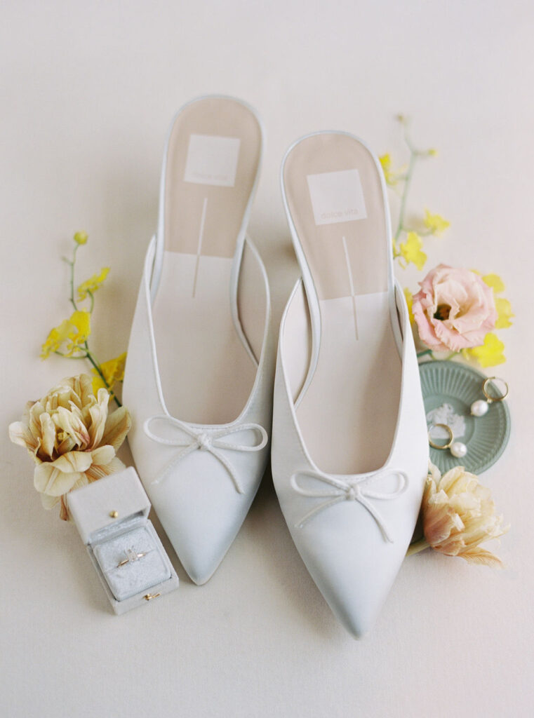 Film photograph of the bride's shoes and bridal details.