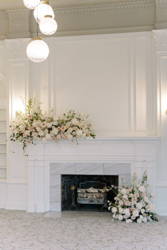 Fireplace flower inspiration. Large-scale flower designs on a fireplace mantel. 