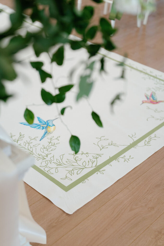 Hand-painted aisle runner in Ritz Charles Chapel Carmel Indiana spring wedding ceremony