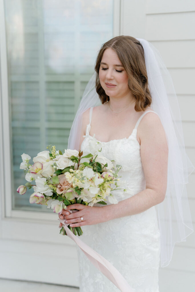 Garden-inspired bridal bouquet with hellebores sweet pea and lisianthus spring wedding florals